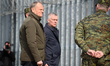 Polish Prime Minister Donald Tusk looks on as he visits soldiers of the Polish Border Guar...