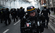 CRS riot police officers use tear gas against demonstrators during a demonstration in Pari...