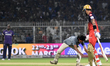 A fan of Royal Challengers Bengaluru's Virat Kohli touches his feet during the Indian Prem...