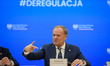 Polish Prime Minister Donald Tusk gestures as he speaks during a meeting with the entrepre...
