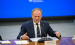 Polish Prime Minister Donald Tusk gestures as he speaks during a meeting with the entrepre...