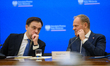 Polish Prime Minister Donald Tusk (R) and Minister for the European Union Adam Szlapka (L)...