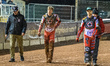 Norick Blodorn of Belle Vue Aces (center) walks back to the pits with Mark Lemon, Team Man...