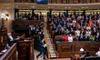 Spanish Prime Minister Pedro Sanchez receives applause from his deputies after his speech...