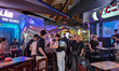 People walk and gather at bars and restaurants in the Amusement District of the Old Quarte...
