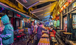 People walk and gather at bars and restaurants in the Amusement District of the Old Quarte...