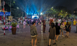 Crowds gather for night entertainment and youth performances near Trang Tien Plaza in cent...