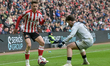 Sunderland's Chris Rigg competes against former Sunderland player and current Millwall pla...