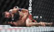 Brandon Moreno of Mexico punches and works for a submission against Steve Erceg of Austral...