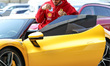 Lewis Hamilton of Great Britain and Scuderia Ferrari arrives at the track during practice...