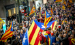Hundreds of people gather at Barcelona Sants, the city's main train station, in a protest...