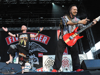Ivan Moody (L) Zoltan Bathory with Five Finger Death Punch perform during River City Rockfest at the AT&T Center on May 24, 2014 in San Anto...