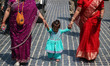 Kashmiri Pandits participate in a religious procession to celebrate the Hindu festival of...