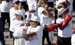 A woman participates in Mexico's National Mass Boxing Class as part of the campaign for pe...
