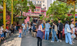 Crowds of people gather in the courtyard at the entrance of Phuoc Hai Temple, also known a...