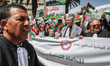Tunisian lawyers dress in legal gowns with the Palestinian scarf (keffiyeh) on their shoul...