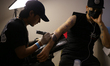 Tattoo artists and enthusiasts get tattooed during the ''Nepal Tattoo Convention'' organiz...