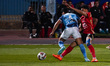 Al-Ahly player Akram Tawfik is in action with a Pyramids player during a match between Al...