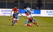 Al-Ahly player Akram Tawfik competes with Pyramids player Mostafa Fathy during a match bet...