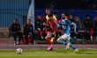 Al-Ahly player Wessam Abo-Ali is in action with a Pyramids player during a match between A...
