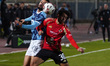 Al-Ahly player Mohamed Hany is in action with Pyramids player Marwan Hamdy during a match...
