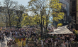 People gather, drink, eat, and relax outside the Gasteig cultural center in Munich, German...