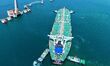A cargo ship loaded with imported crude oil docks at the dock at Qingdao Port in Shandong...