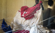 Parachute packers prepare skydiving equipment for new jumps at Swakopmund, Namibia. Well e...