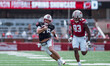 Wisconsin Badgers quarterback Danny O'Neil #18 runs the ball during the Wisconsin Football...