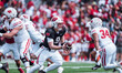 Wisconsin Badgers quarterback Billy Edwards Jr. #9 hands off the ball during the Wisconsin...