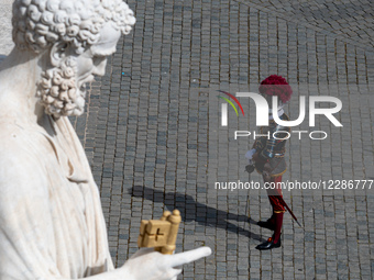 Swiss Guards stand on the parvis of the basilica before the Easter Mass as part of the Holy Week celebrations at St. Peter's Square in the V... by Massimo Valicchia/NurPhoto