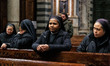Faithful gather in prayer in Cathedral Square after news of Pope Francis' death in Pisa, I...