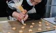 An employee prepares praline pastries at the artisanal company La Turbine a Saveurs in the...