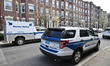 Boston police maintain a presence following a domestic violence incident that leaves an in...