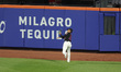 New York Mets right fielder Juan Soto #22 makes a catch during the seventh inning of a bas...