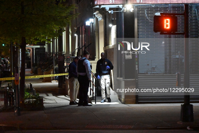61-year-old Woman Fatally Shot To The Head And A 23-year-old Man Wounded After Being Shot To The Foot At West 113 Street And Lenox Avenue In Harlem, Manhattan, New York