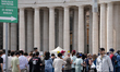 Visitors are seen near the Vatican, following the Pope's death, in Rome on April 23, 2025....