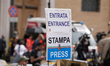 A sign is seen at the entrance of the media enclosure near the Vatican, following the Pope...