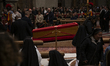 Pope Francis lies in the coffin with the papal mitre, the solemn headdress worn by the hig...