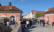 People line up in front of an ice cream shop on a sunny afternoon in Regensburg, Upper Pal...