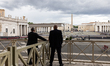 After paying homage to the late Pope, people crowd the balcony overlooking St. Peter's Squ...