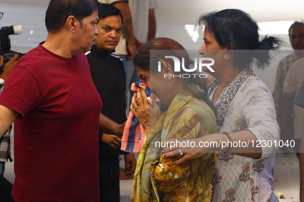 Mother and other family members mourn during the last rites of Neeraj Udhwani, who is killed in the Pahalgam terror attack, in Jaipur, Rajas...