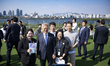 Former President Moon Jae-in poses for a photo with citizens while walking through a park...