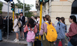 People wait in line outside St. Peter's Basilica to view the body of Pope Francis in Rome,...