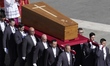 A casket with the body of Pope Francis is seen being carried at the Vatican in Rome, Italy...