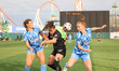 DC Power FC defenders Madison Wolfbauer #29 and Susanna Fitch #3 surround Brooklyn FC forw...