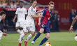Frenkie de Jong of FC Barcelona competes for the ball with Luka Modric of Real Madrid duri...