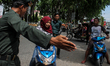 Sharia police intercept a woman motorists on the road in the city of Lhokseumawe, Aceh pro...