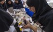 Medical personnel check blood bags at the Tehran Blood Transfusion Center in Tehran, Iran,...