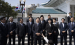 Lee Jae-myung, along with Democratic Party leaders and lawmakers, speaks briefly to report...